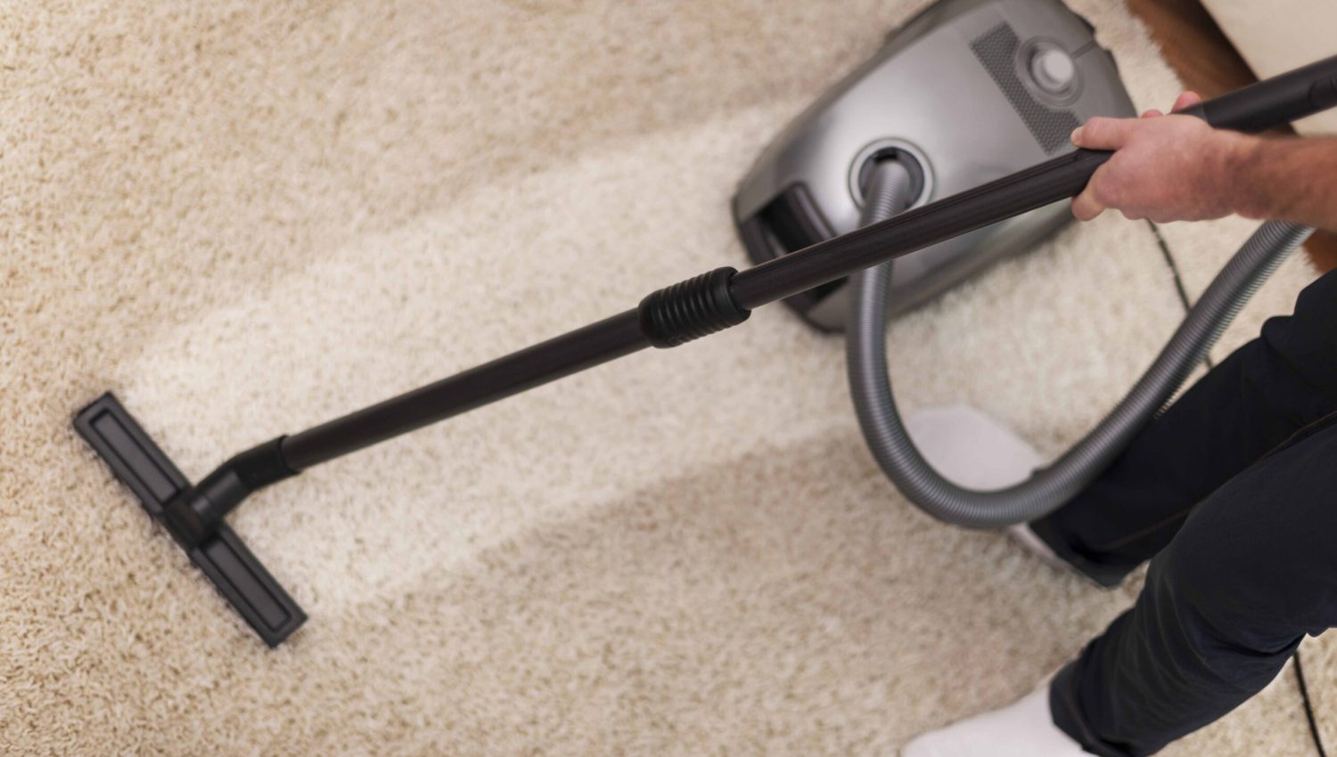 Close up of vacuuming a carpet